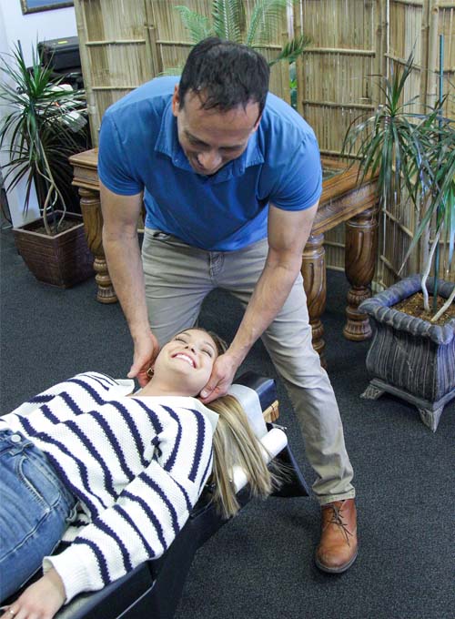 Chiropractor Wichita KS Randy Babcock With Patient HP About Us